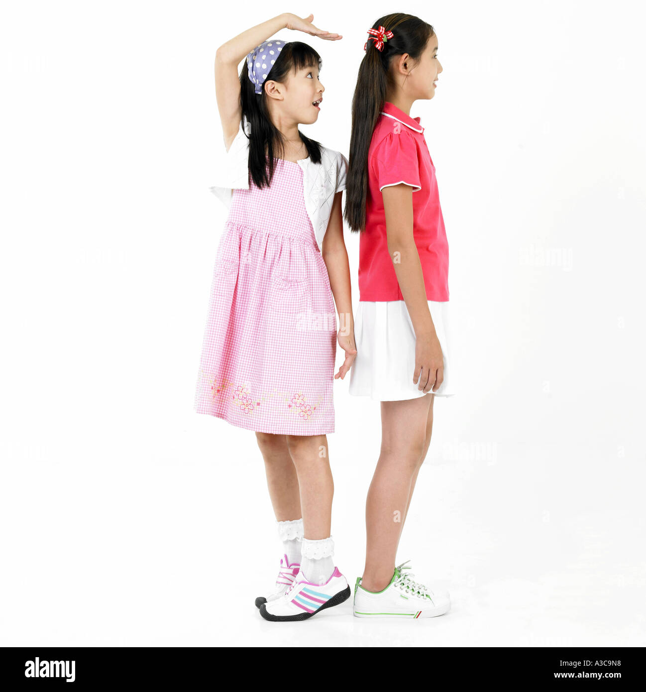 Girl measuring height Stock Photo Alamy