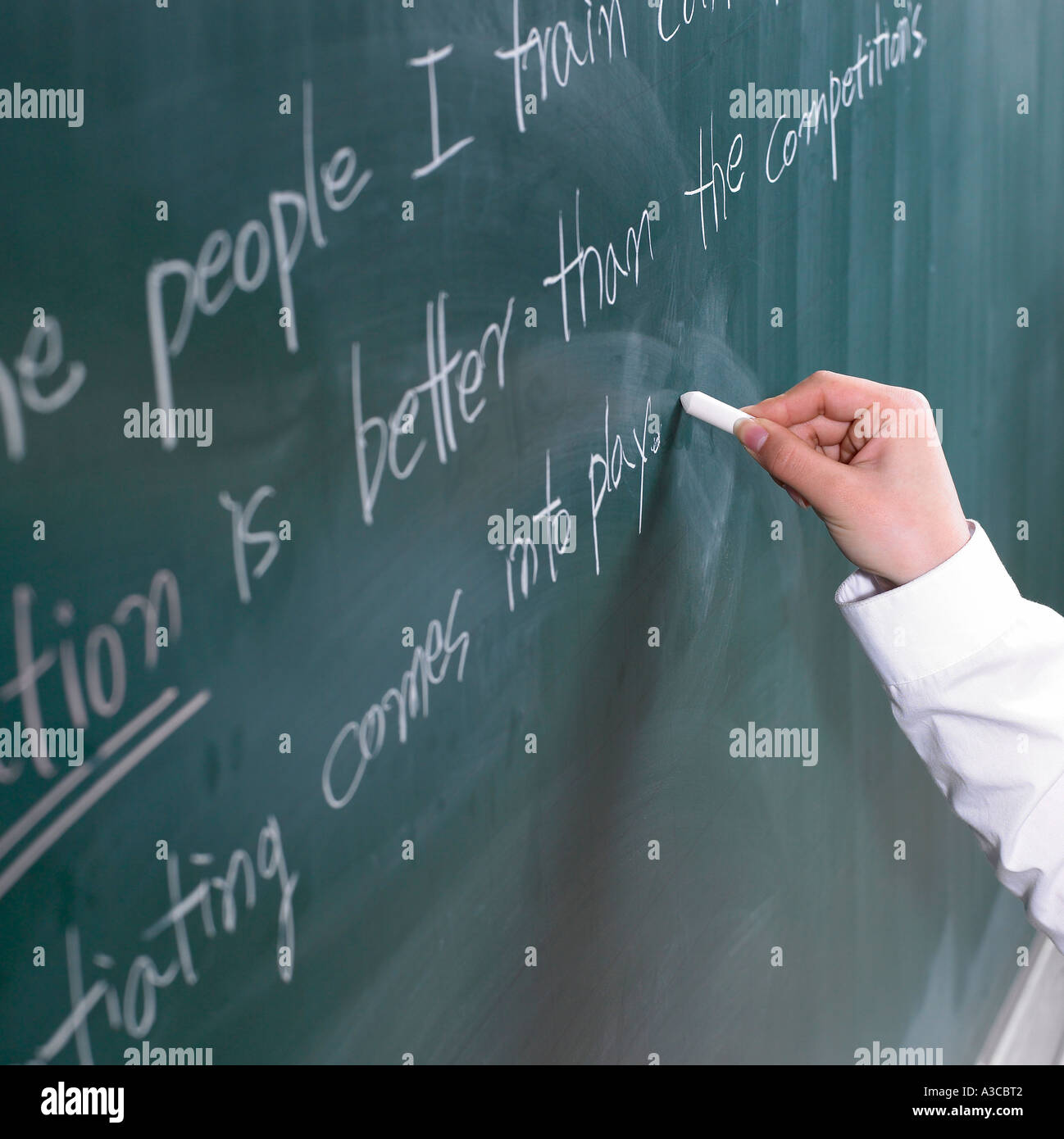A student writing English sentences on the board Stock Photo 6138049