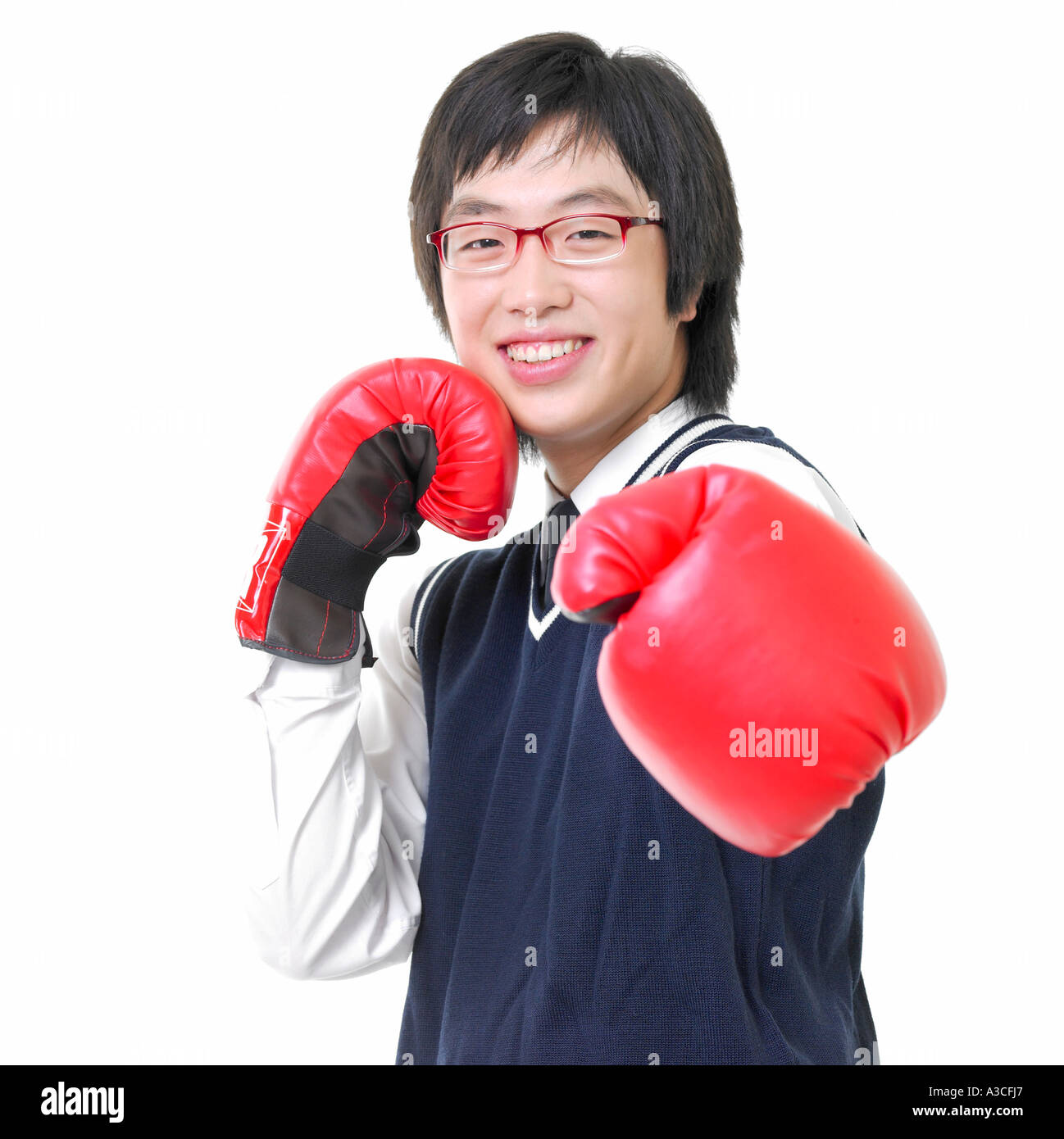 A male student with glasses is wearing boxing gloves Stock Photo Alamy
