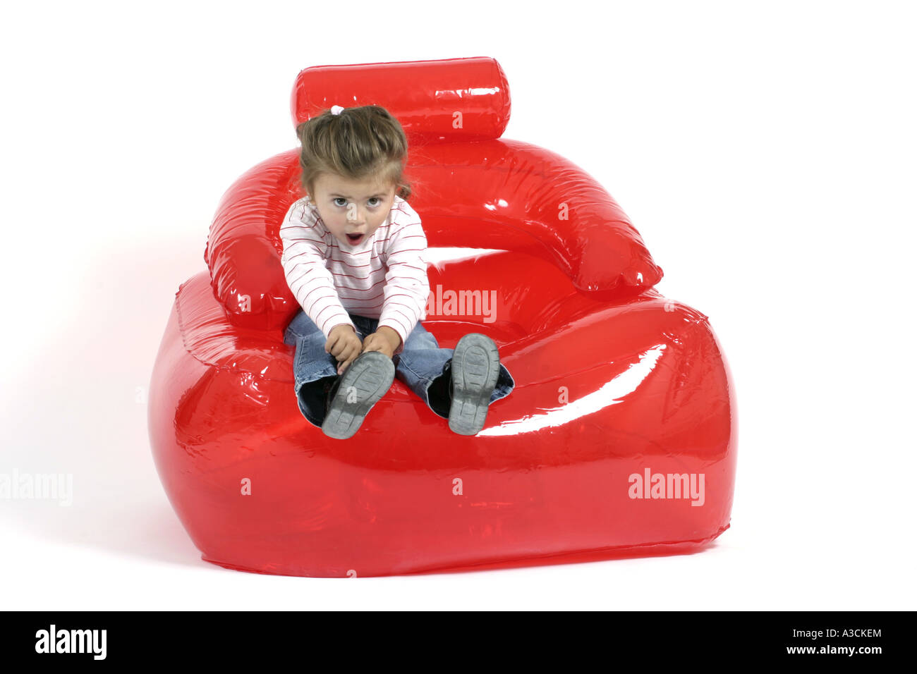little girl in air chair Stock Photo