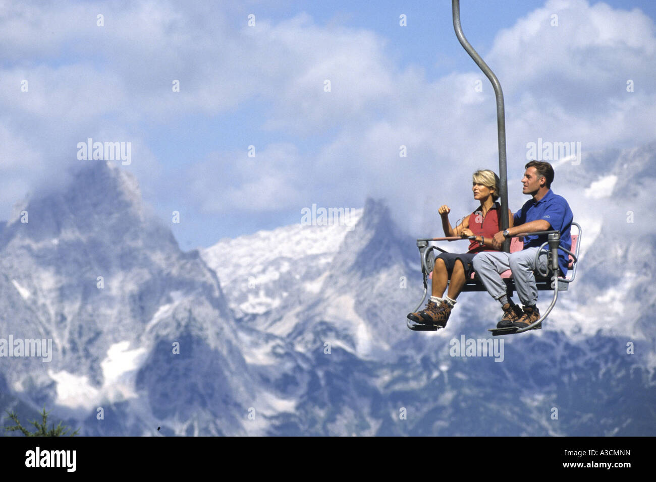 Pair in a chair lift hi-res stock photography and images - Alamy