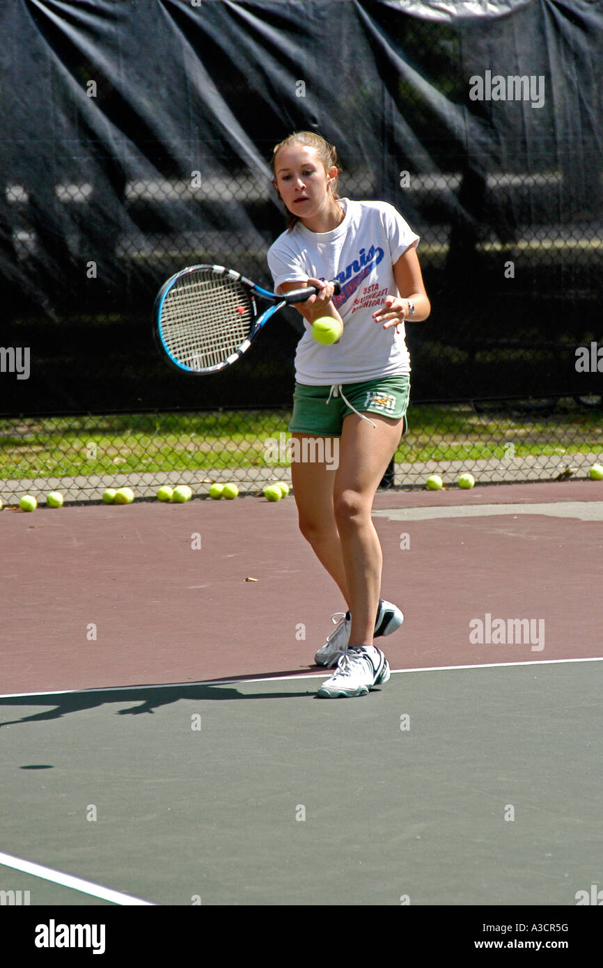 Teenage female playing at a High School tennis game in Michigan Stock
