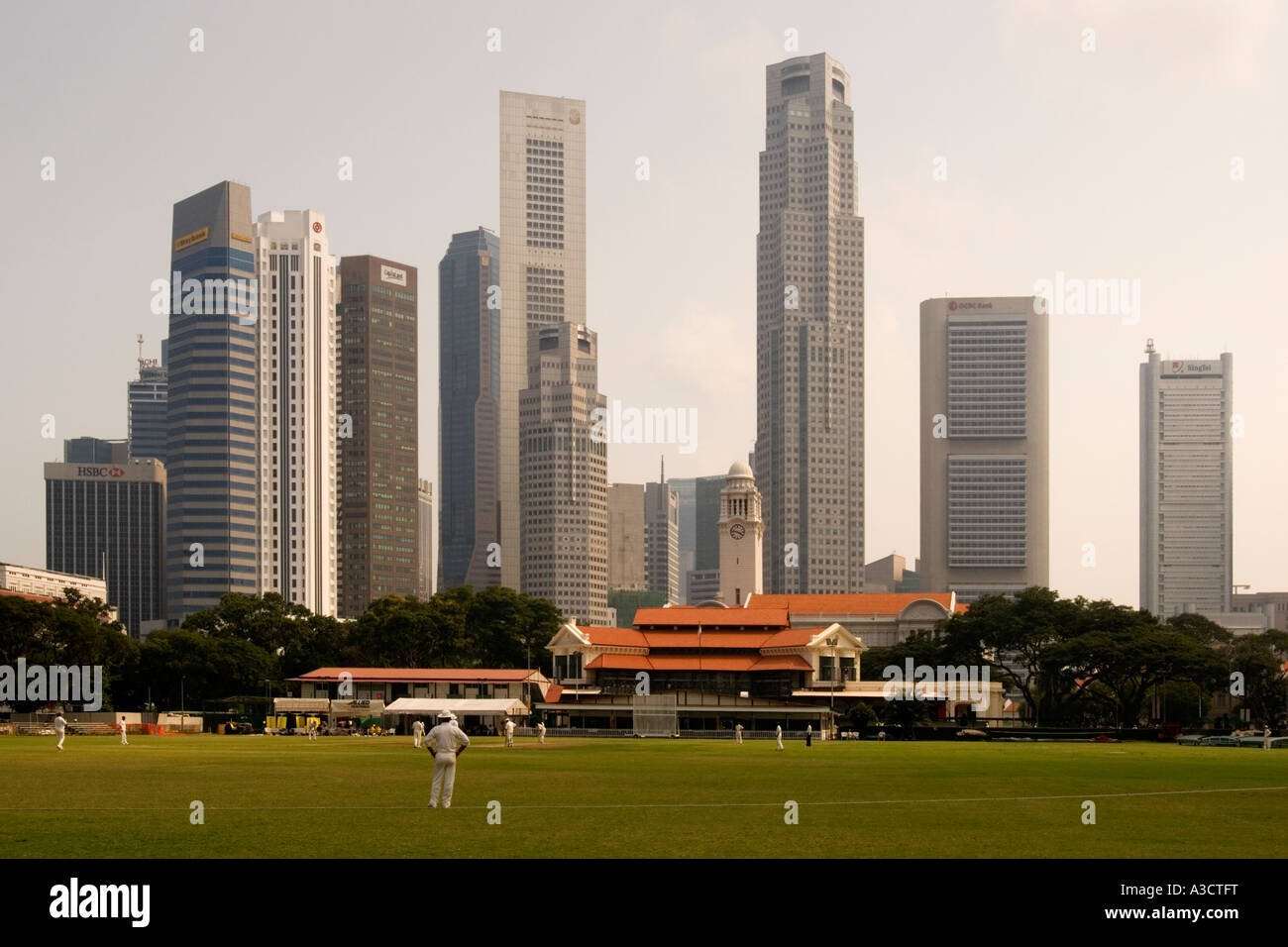 Singapore Cricket Club (c. 1884), with Central Business District behind Stock Photo