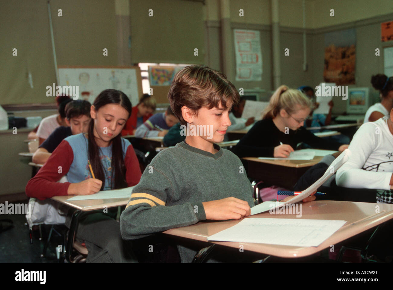 Junior high school students taking a social studies test in class Stock