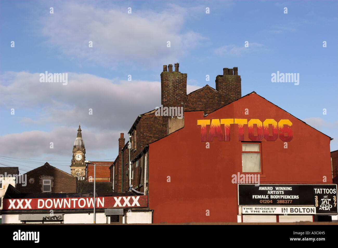 Tattoo and piercing shop sign in Bolton Stock Photo Alamy