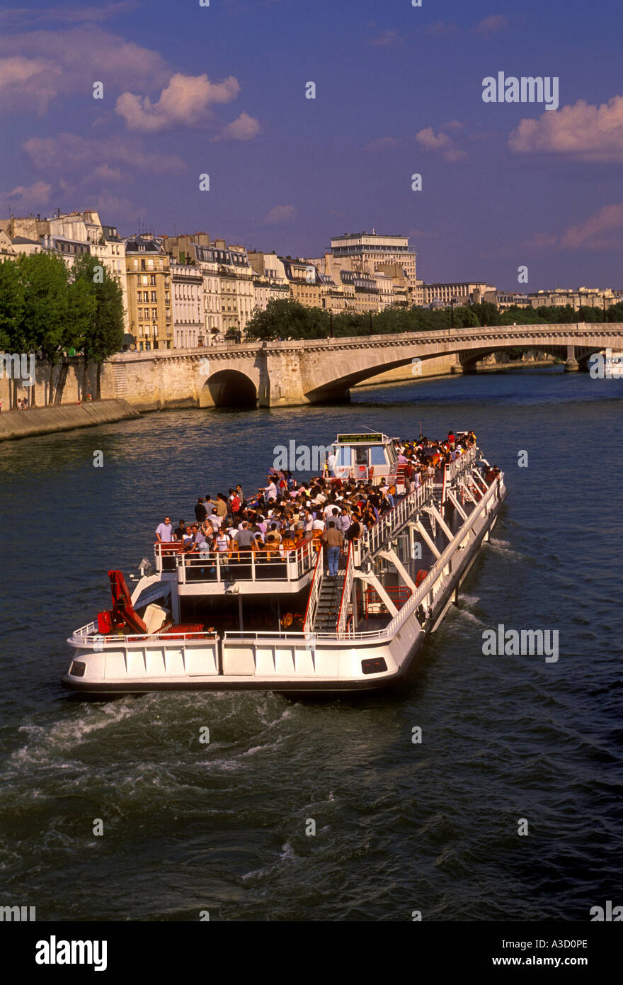 people, tourists, sightseeing boat, boat ride, boat cruise, Seine River, Ile St Louis, Paris, Ile-de-France, France, Europe Stock Photo