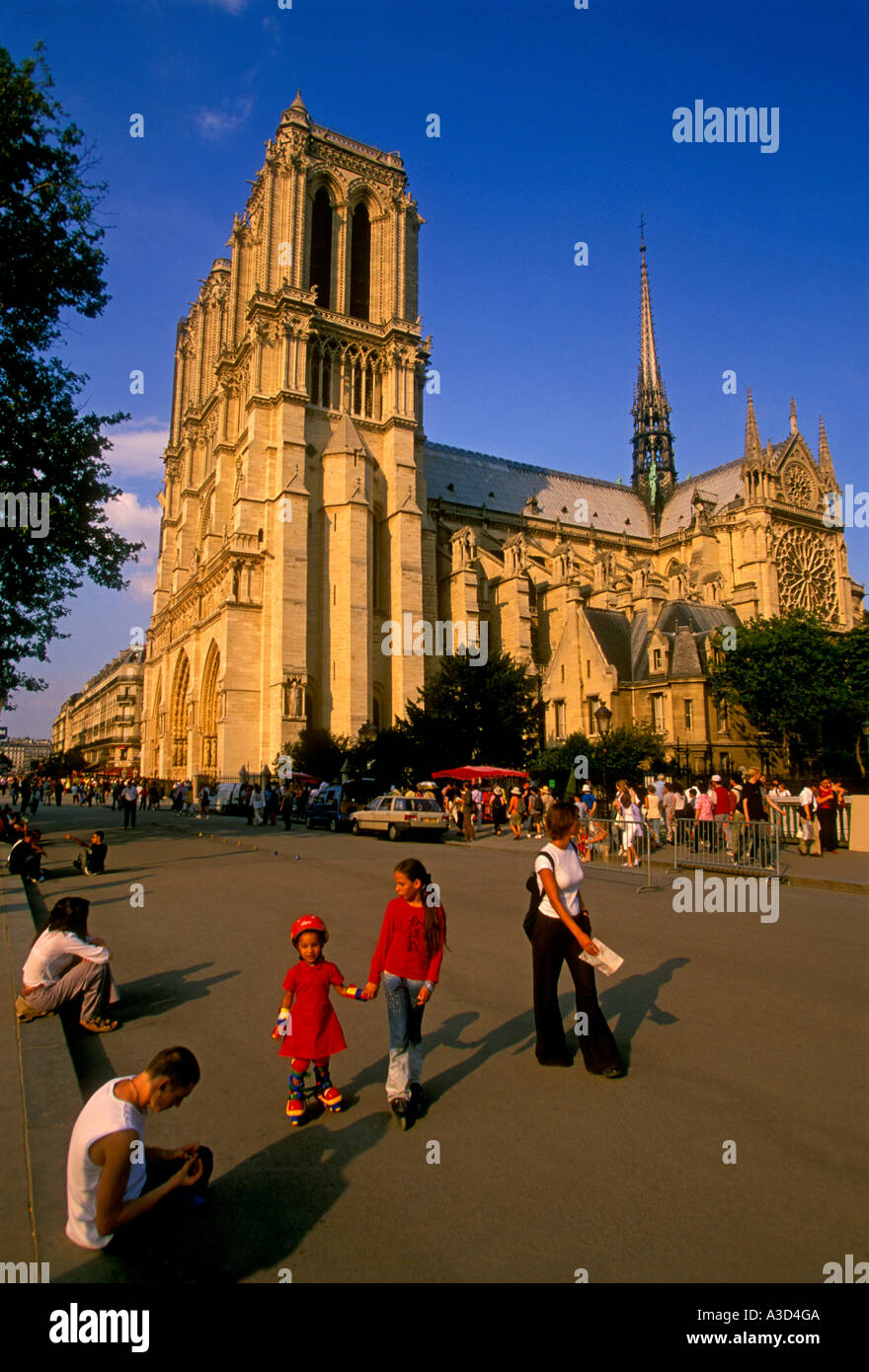 French children rollerblading near Notre-Dame Cathedral, Paris, Ile-de-France, France, Europe Stock Photo