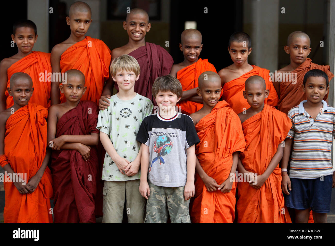 Portrait of class of young student Buddhist monks in traditional robes