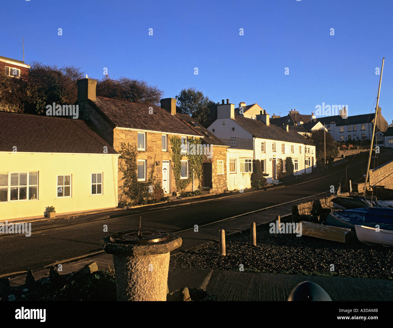 SEAFRONT COTTAGES and sundial by the beach in front. Moelfre Anglesey