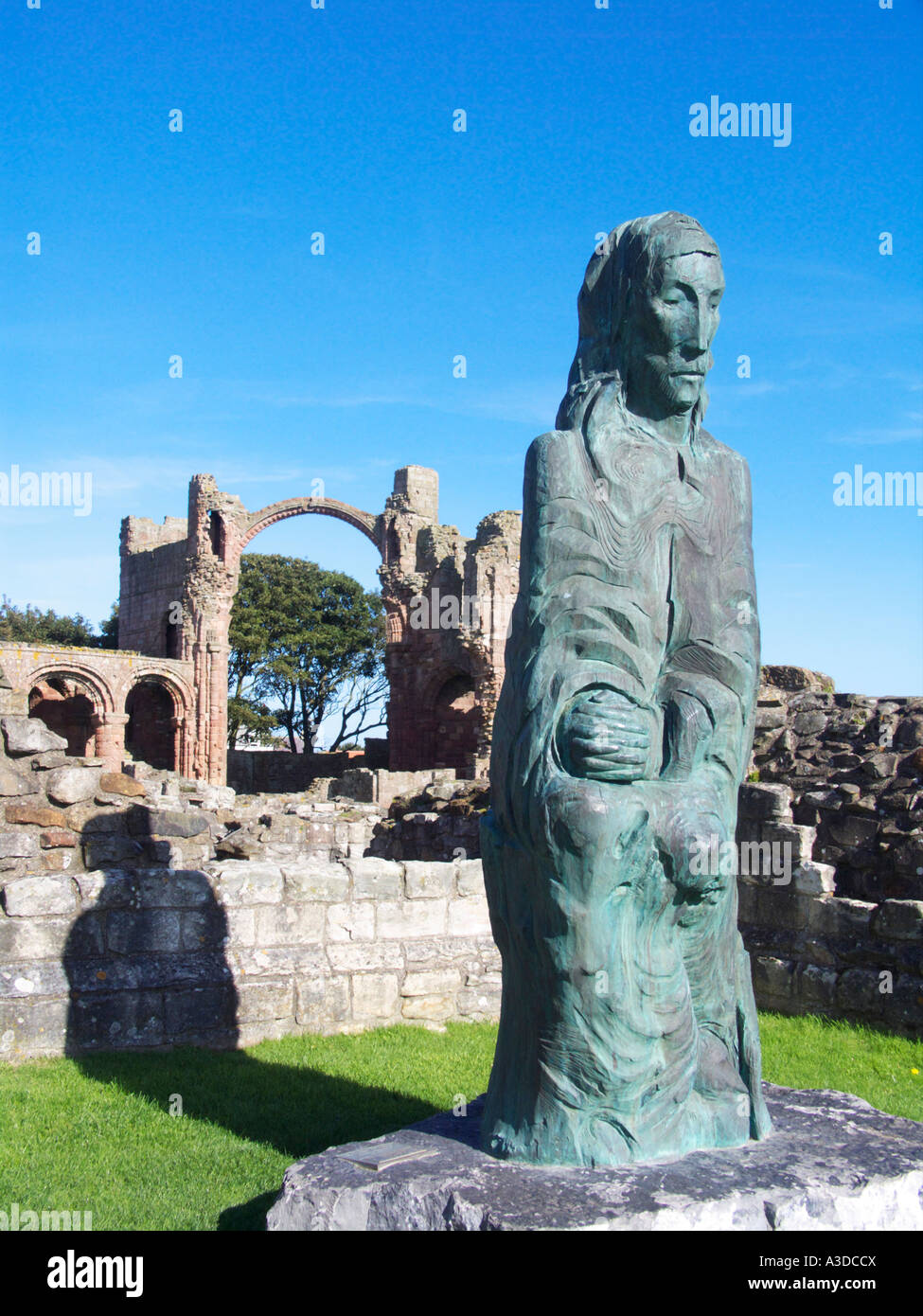 The sculpture Cuthbert of Farne by Fenwick Lawson in the ruins of