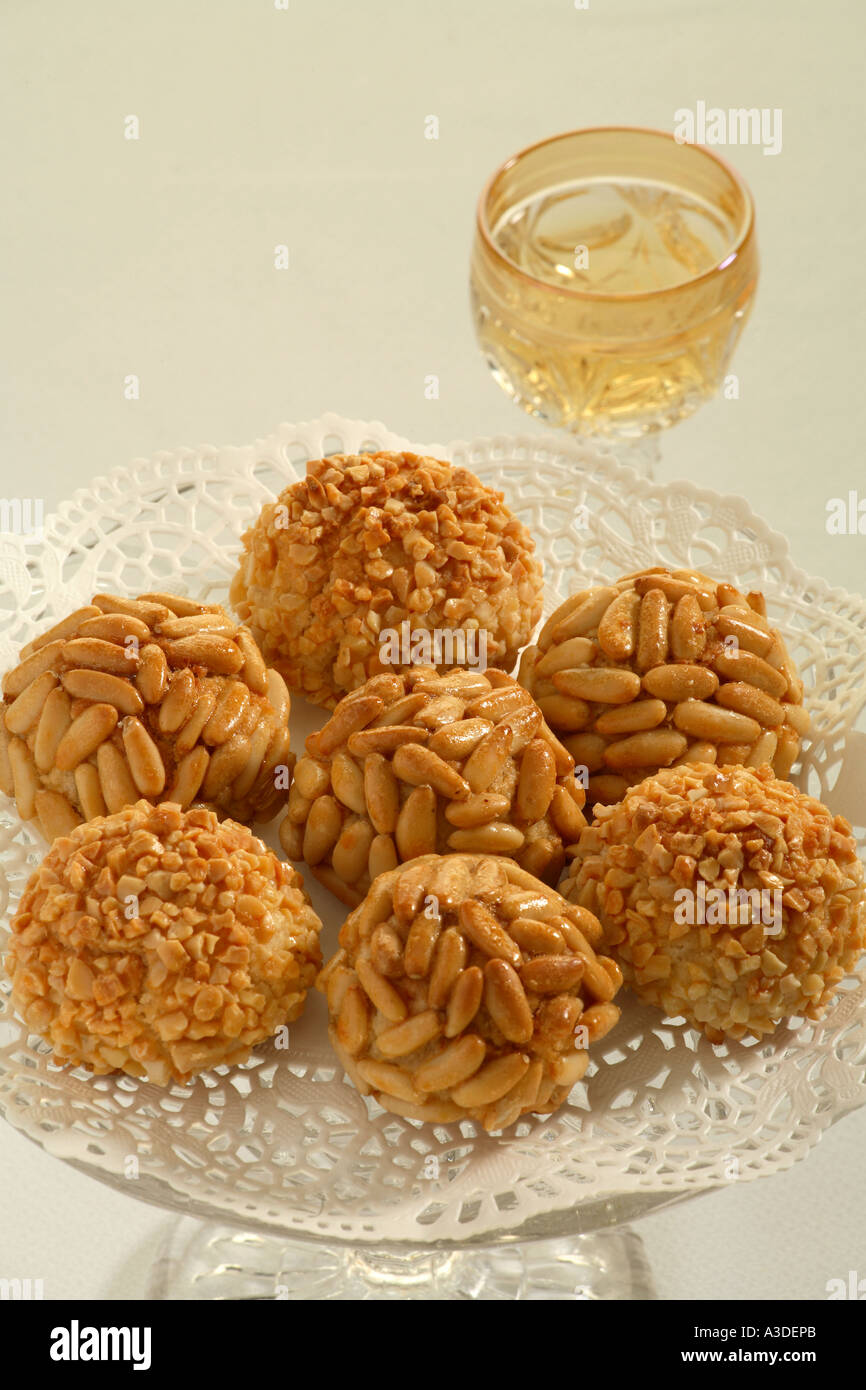 Plate of Panellets with glass of sweet muscatel wine Stock Photo