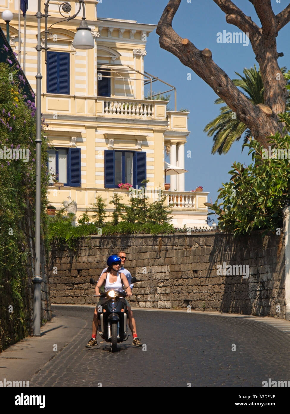 Tourists on Hire Motor Bikes driving on the Via Luigi De Maio Sorrento