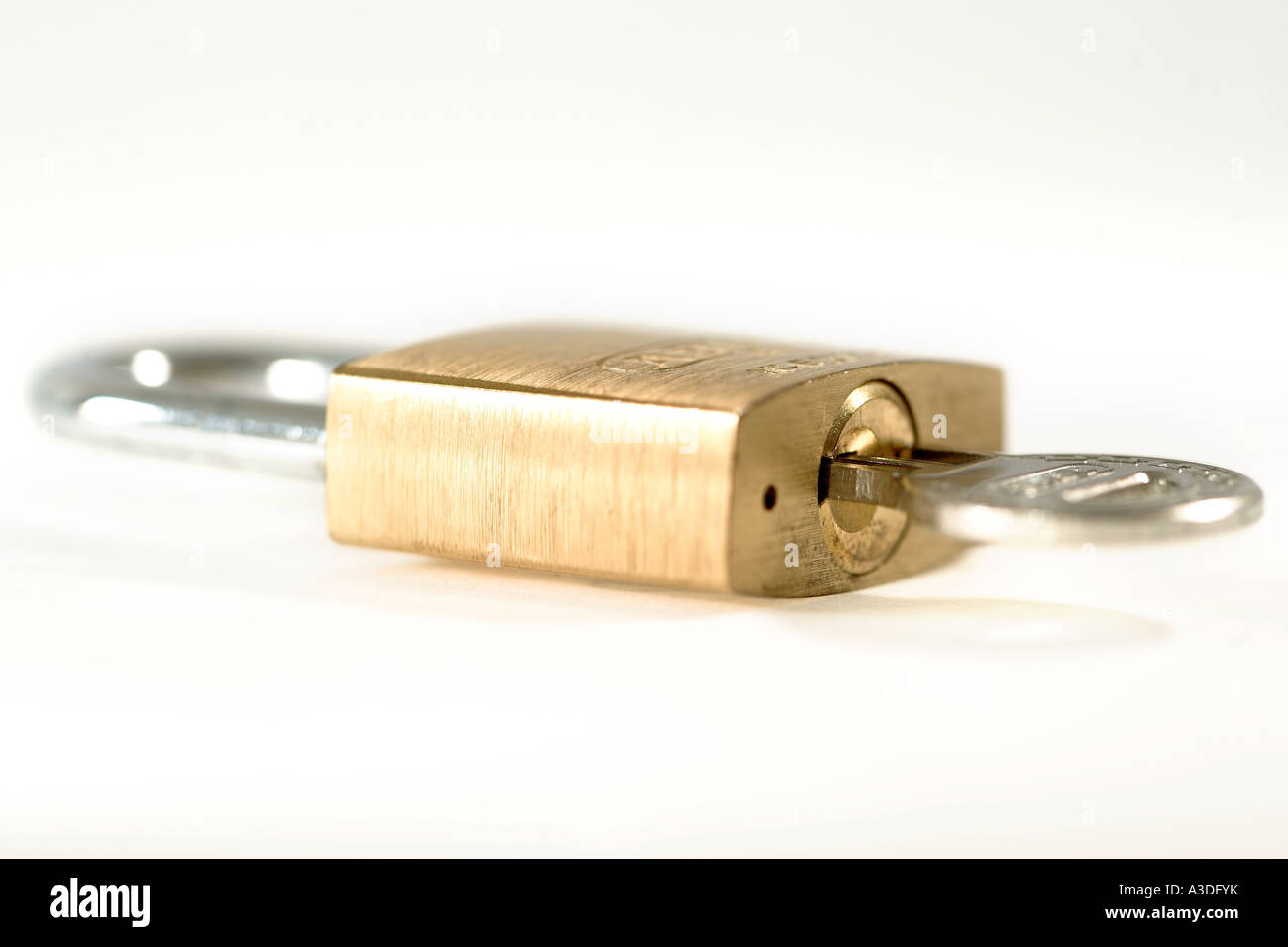 Key inside a locked safety lock Stock Photo Alamy