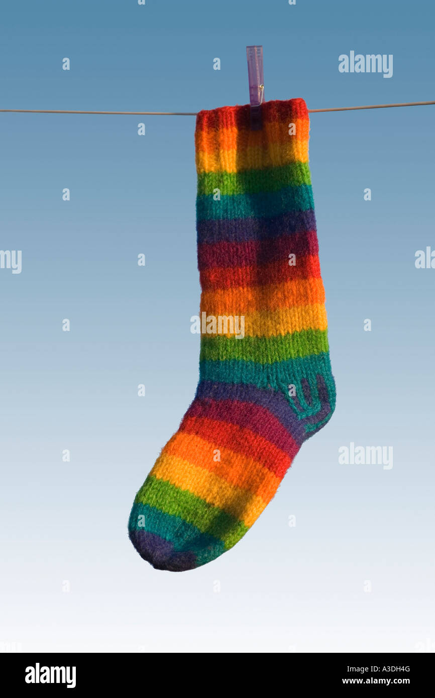 Single striped sock hanging Stock Photo