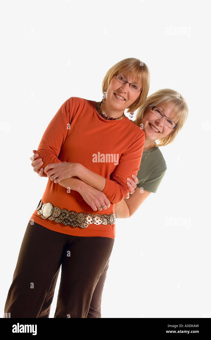 Two women smile pose hi-res stock photography and images - Alamy