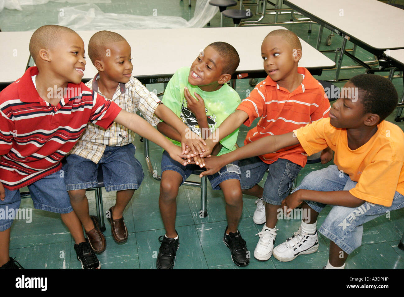 Miami Florida,Overtown,Frederick Douglass Elementary School,campus,Black Afro boy,boys,hands together,FL070121012 Stock Photo