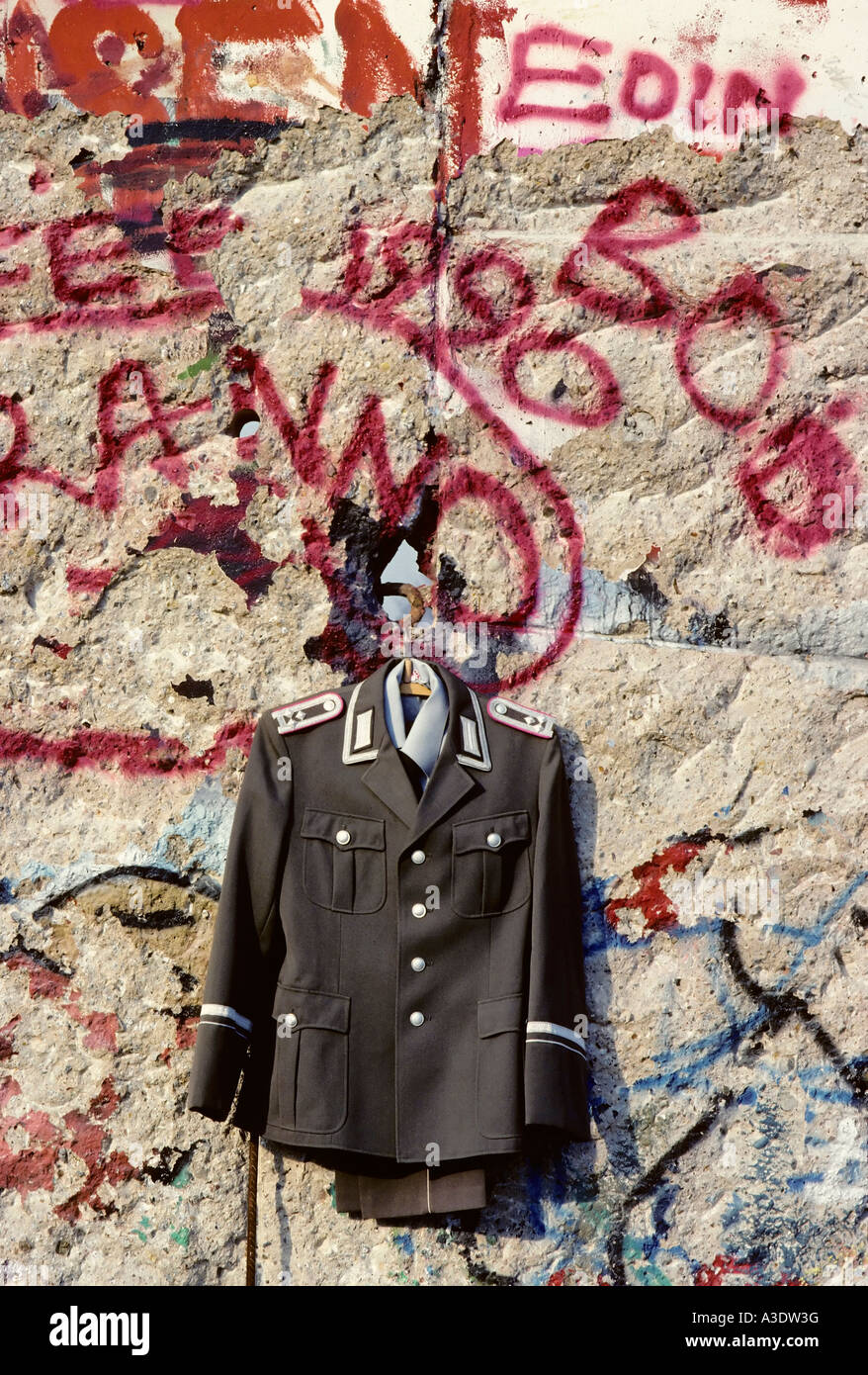 A unifom from the former DDR hangs on the Berlin Wall for sale, Berlin, Germany Stock Photo Alamy