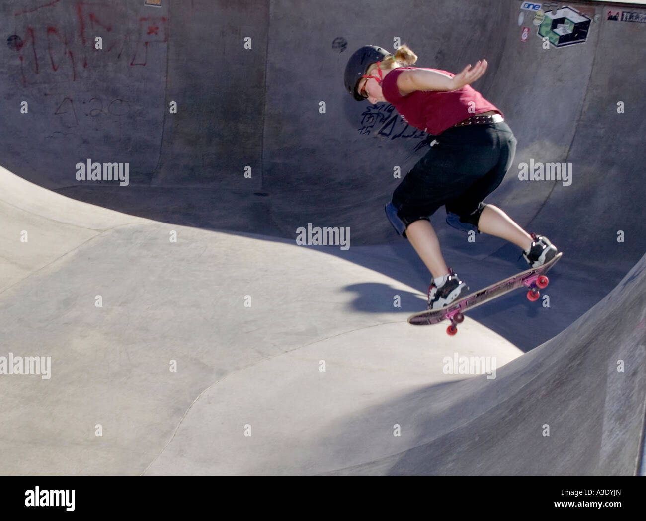 Young Woman Skateboarding In Skate Park In Colorado, USA Stock Photo