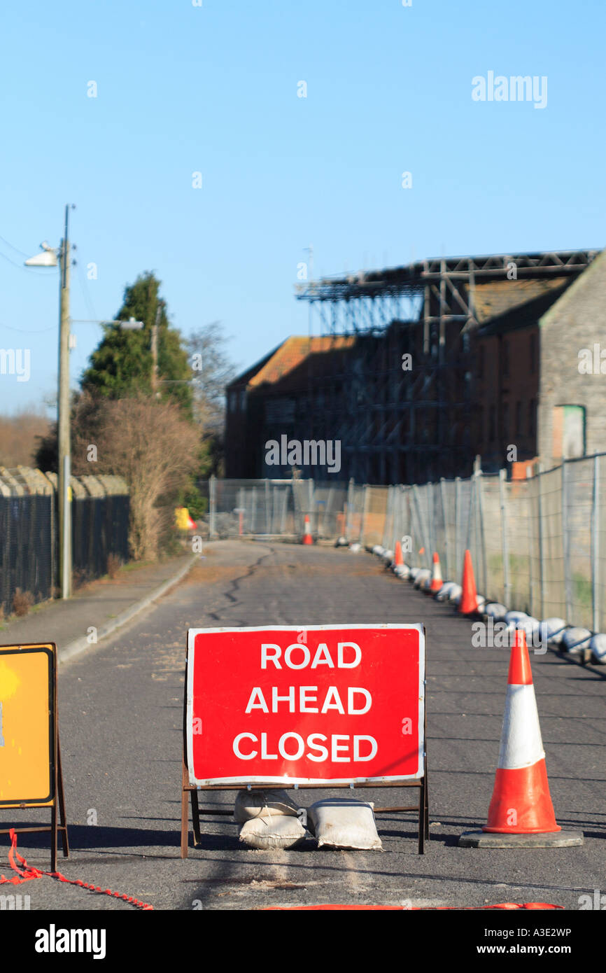 Road Ahead Closed sign board blocking street acess to all vehicles Stock Photo