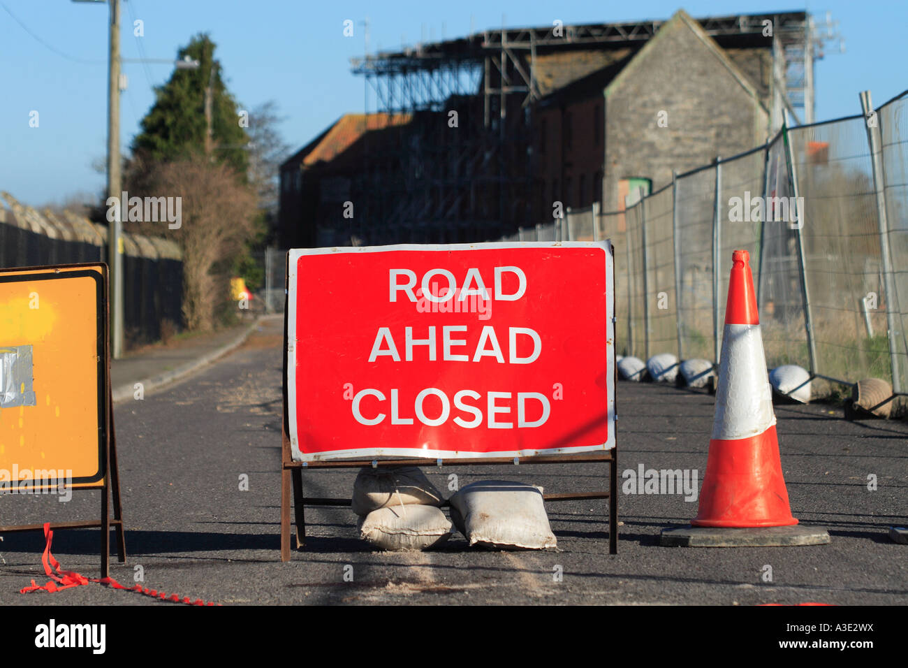Road Ahead Closed sign board blocking street access to all vehicles Stock Photo