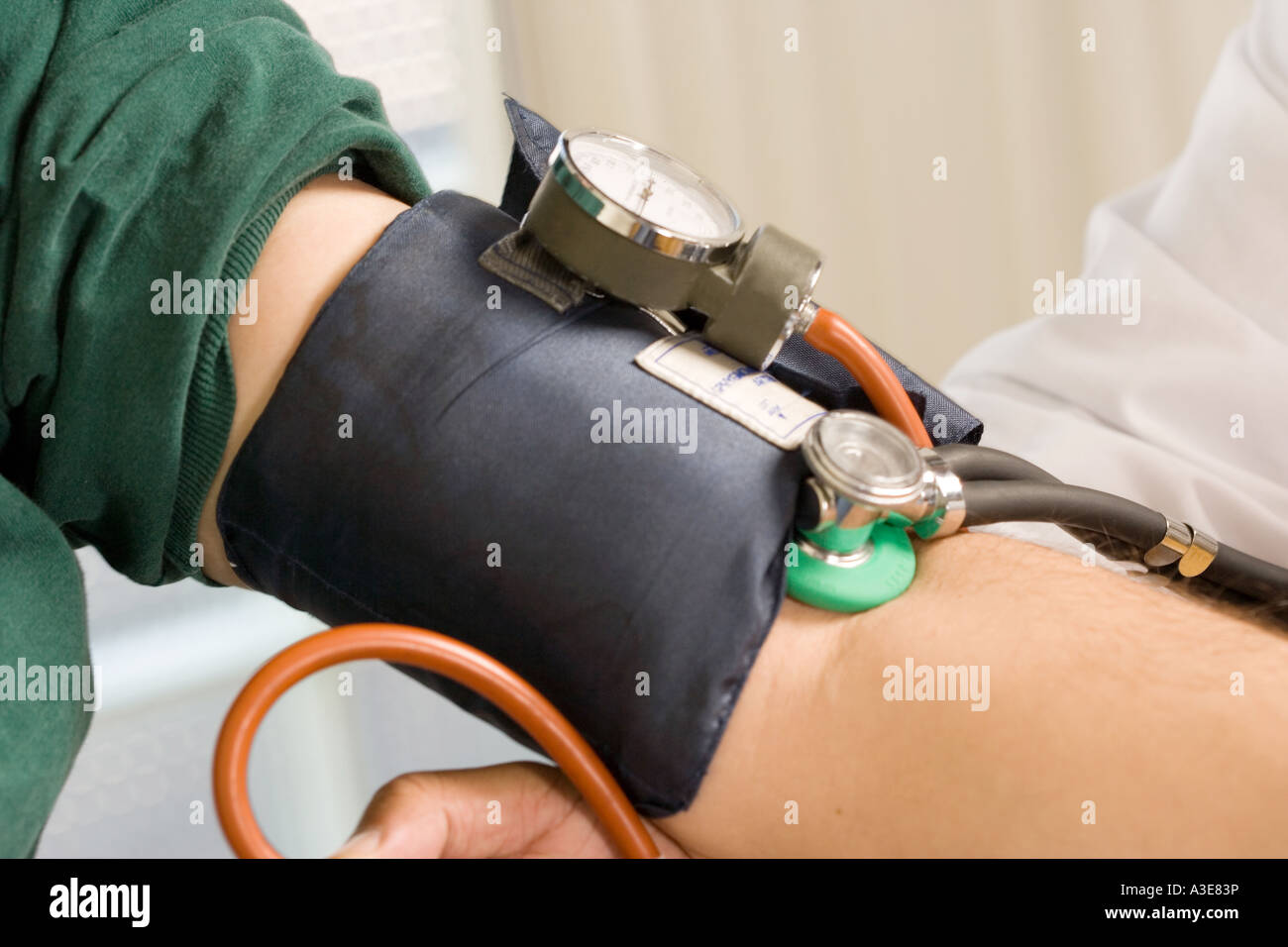 Side view of Blood Pressure monitor  Sphygmometer on patient's arm. Stock Photo