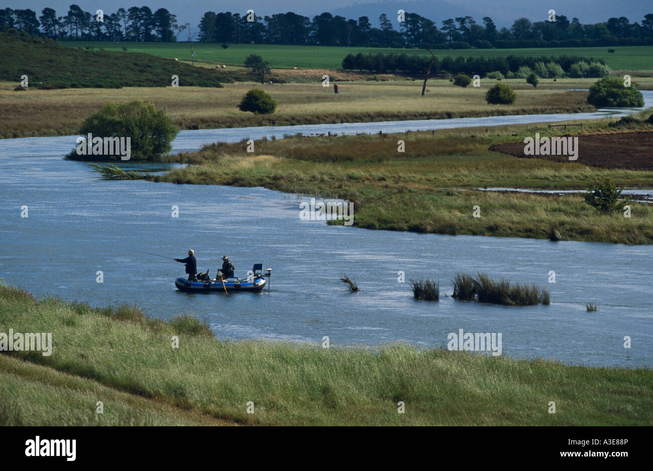 Fly fishing from float tube Macquarie River near Cressy Tasmania