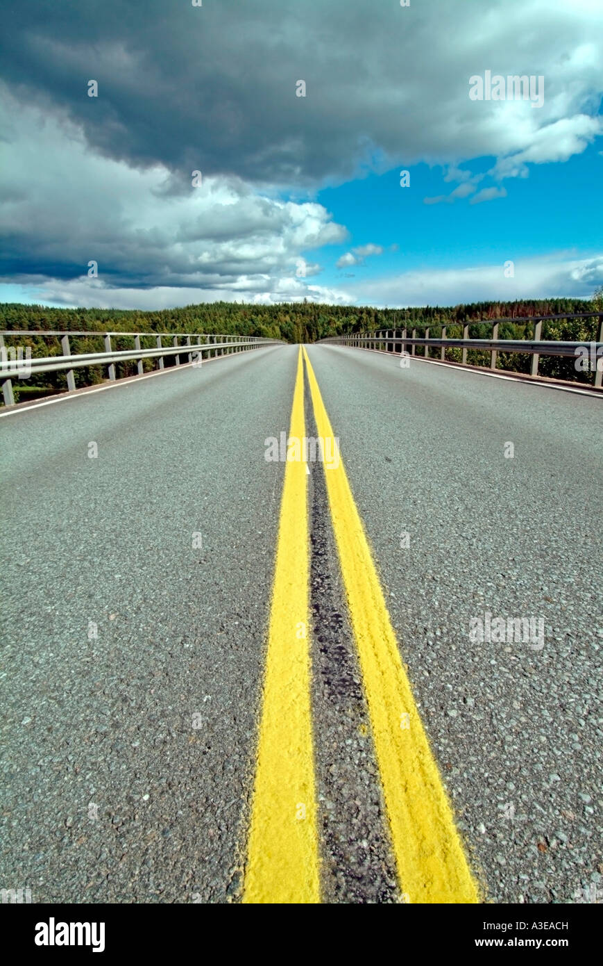Infinite country road leading into the horizon Stock Photo