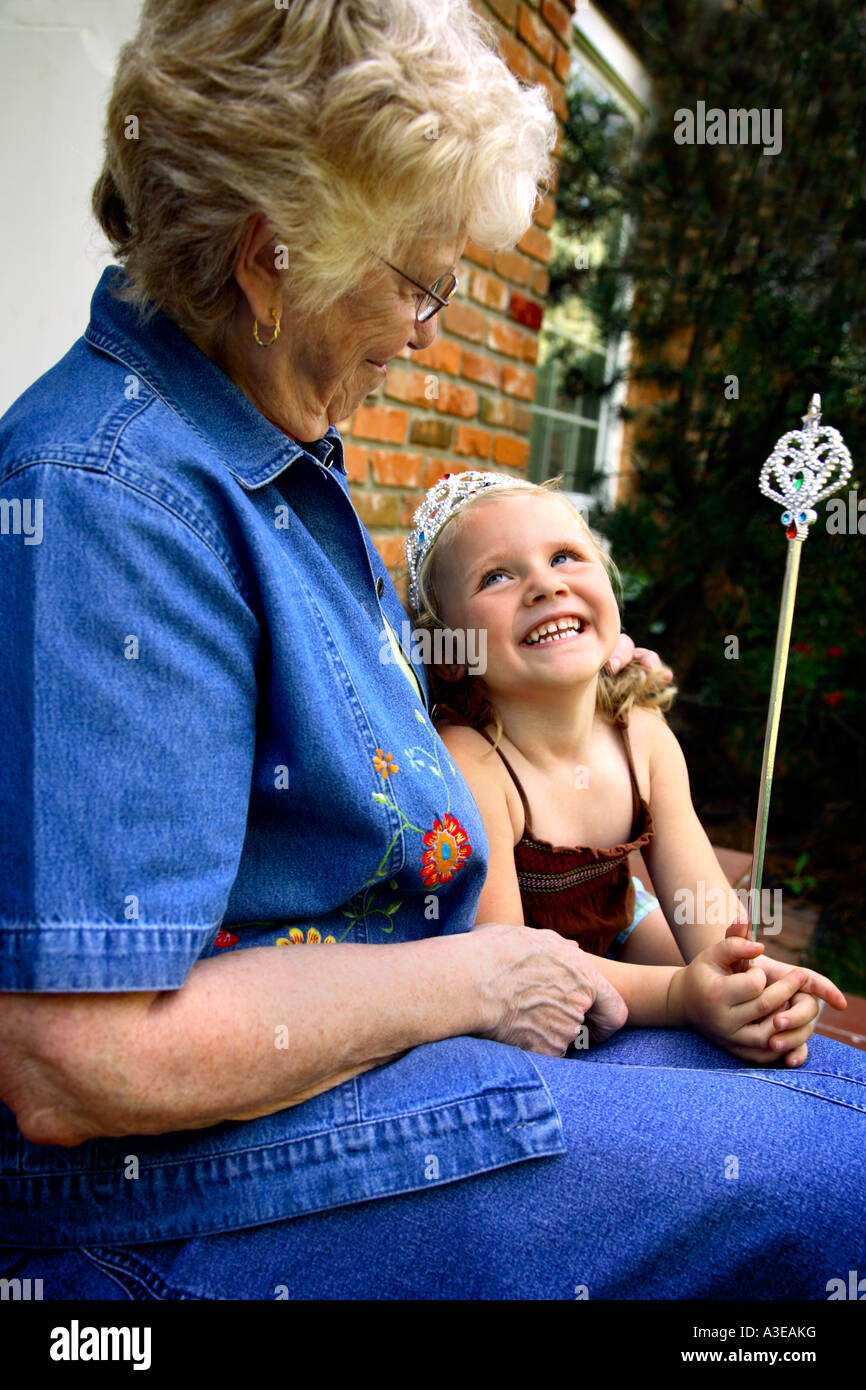 Grandmother with granddaughter dressed up as princess Stock Photo