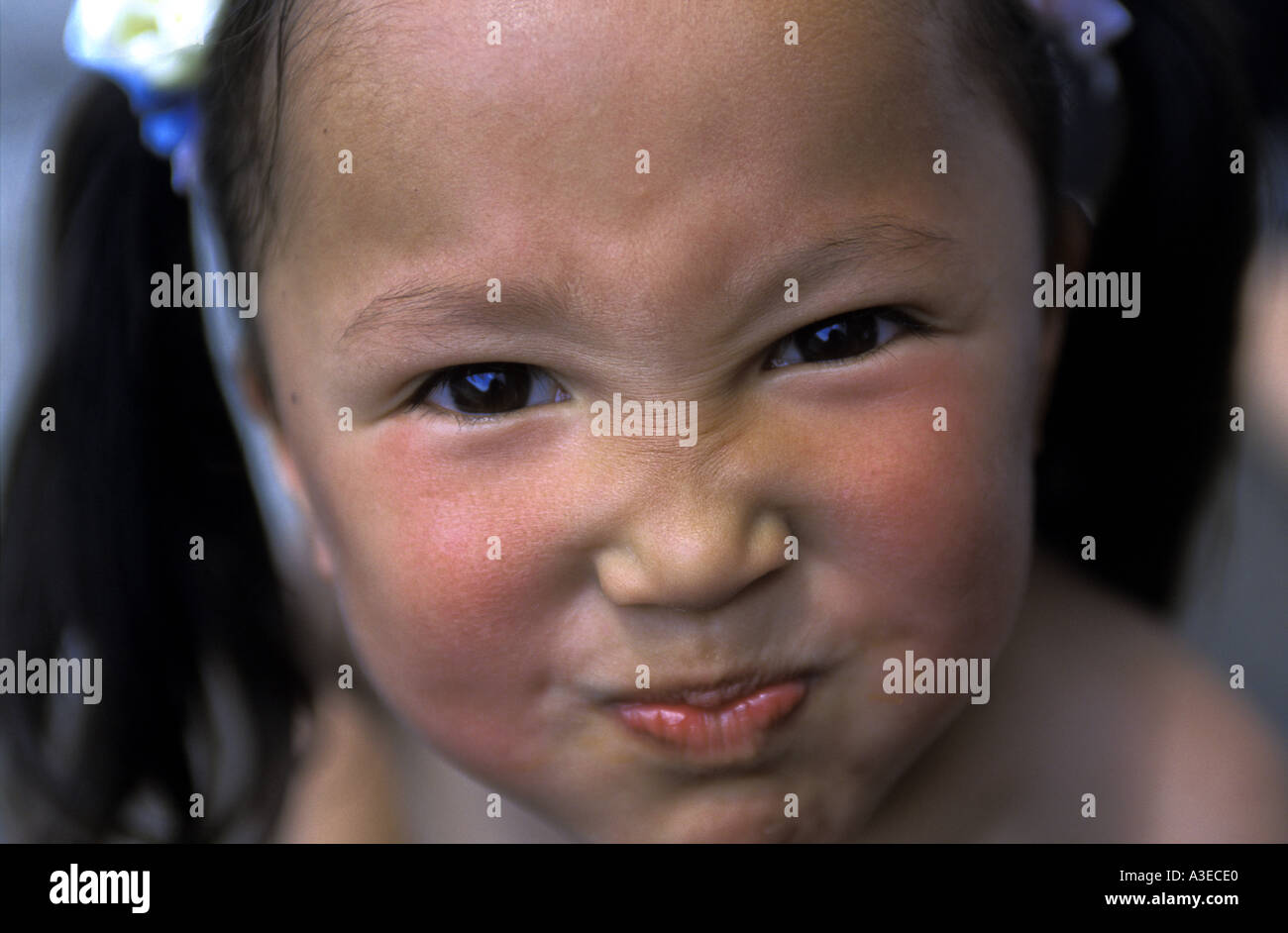 A pouting little girl in Terelj, Mongolia Stock Photo - Alamy