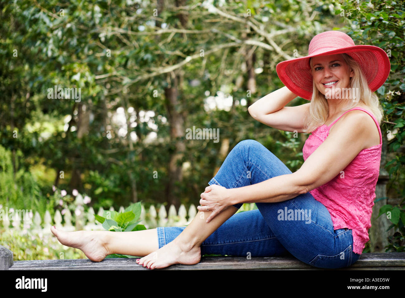 Mature woman tank top outdoors hi-res stock photography and images - Alamy