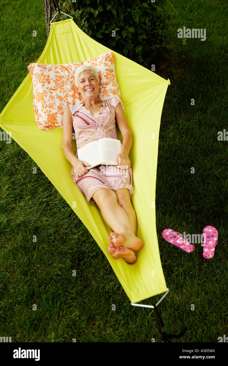 High angle view of a senior woman lying in a hammock and smiling Stock ...