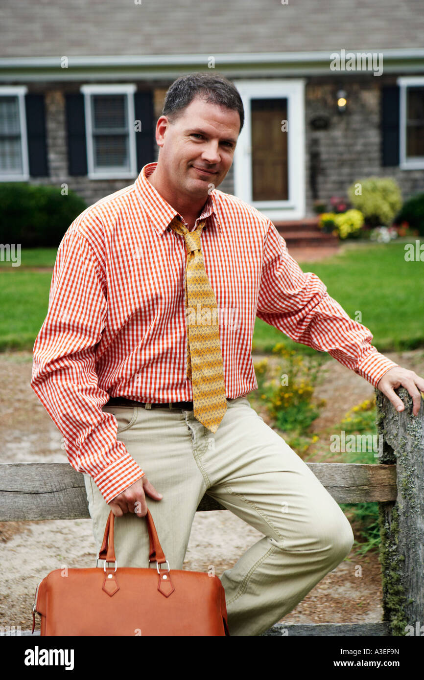 Smiling businessman holding bag hi-res stock photography and images - Alamy
