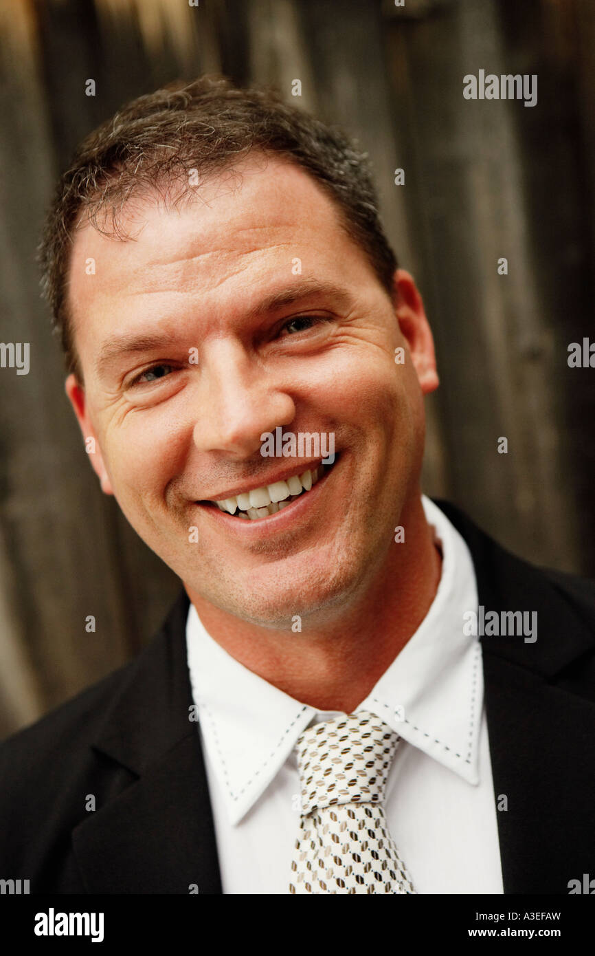 Portrait of a businessman smiling Stock Photo - Alamy