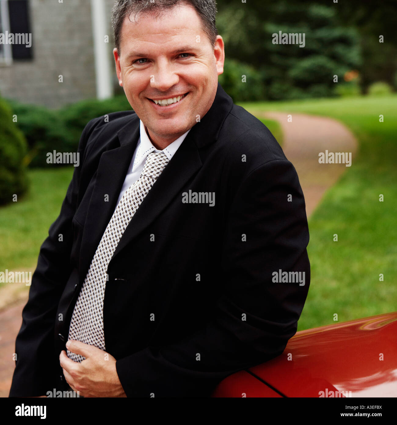 Portrait of a businessman smiling Stock Photo - Alamy