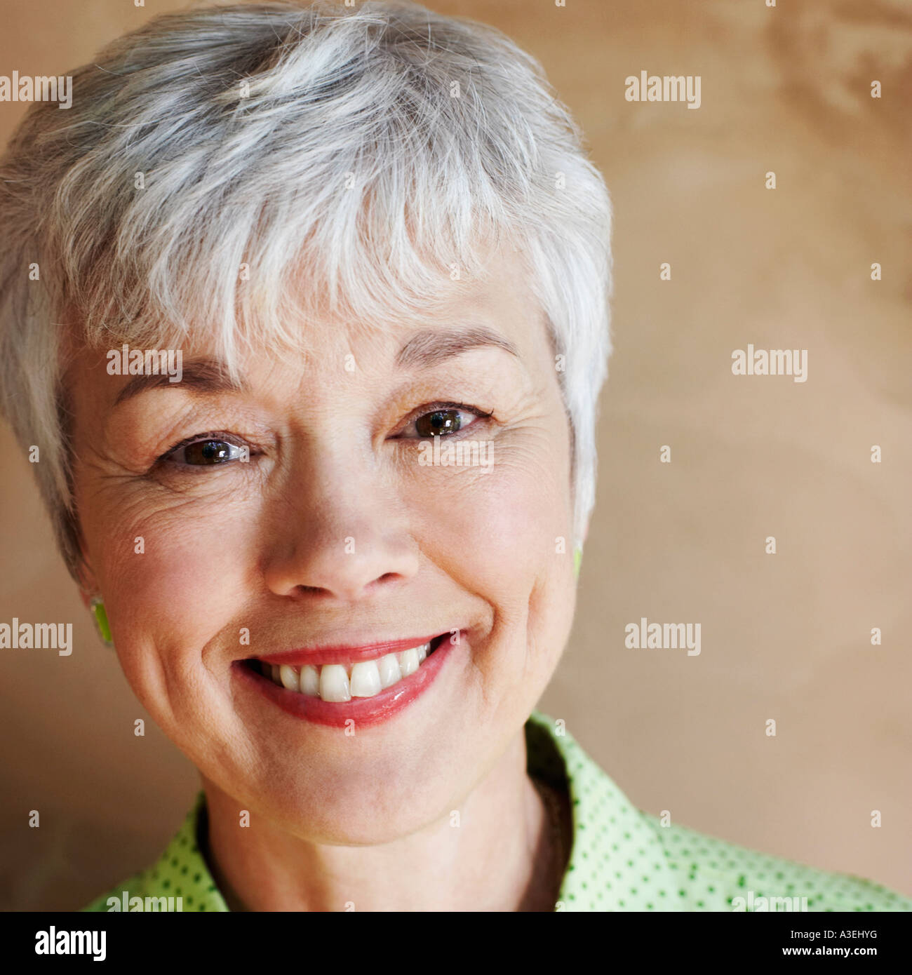 Portrait of a senior woman smiling Stock Photo - Alamy