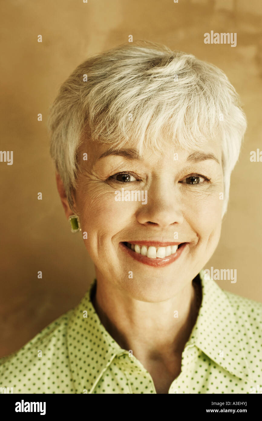 Portrait of a senior woman smiling Stock Photo - Alamy