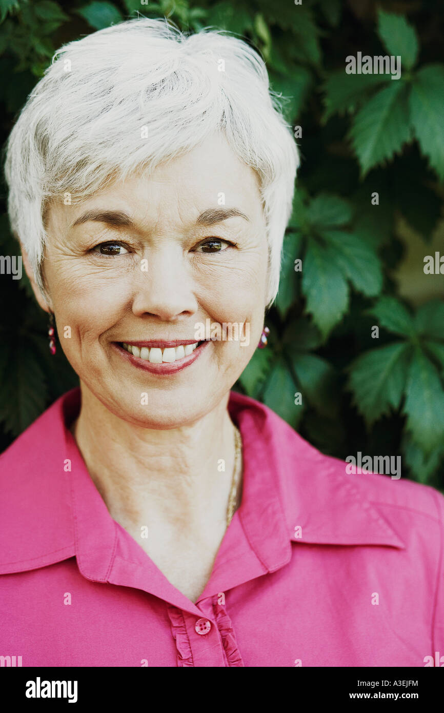 Portrait of a senior woman smiling Stock Photo - Alamy