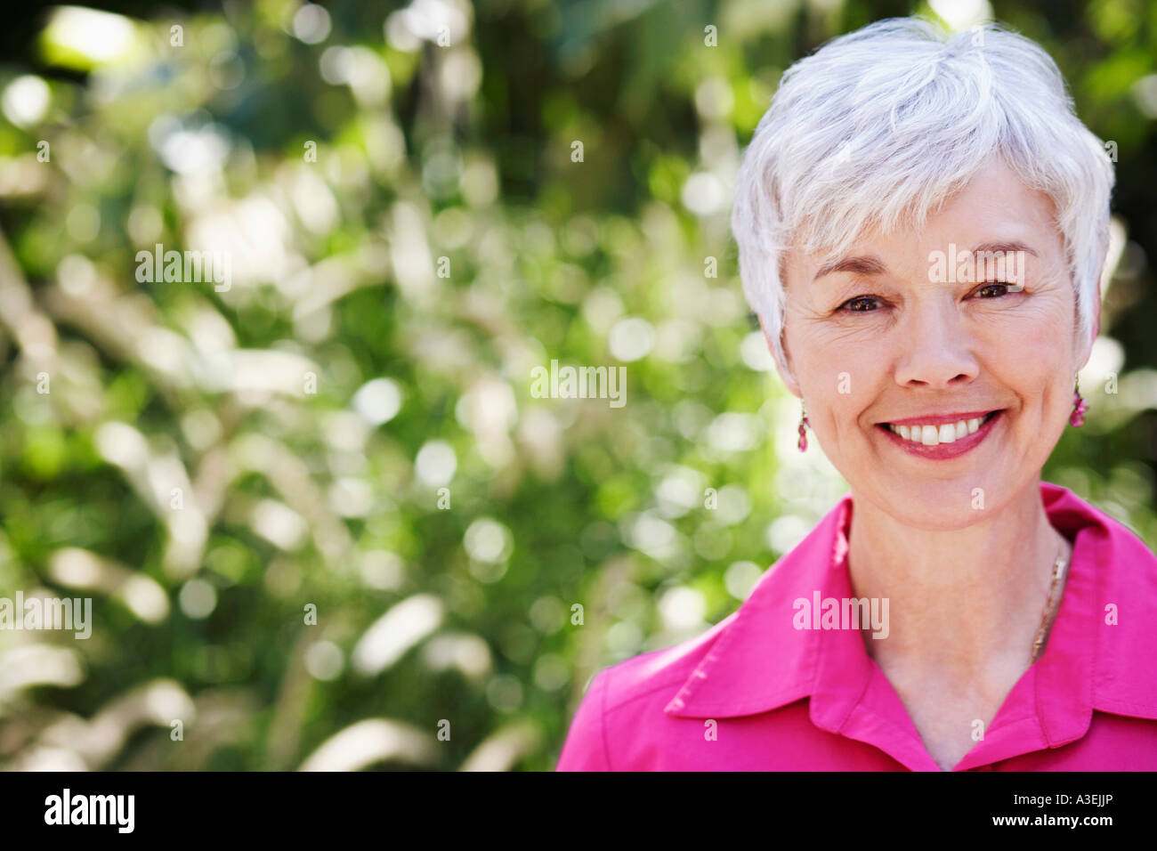 Portrait of a senior woman smiling Stock Photo - Alamy