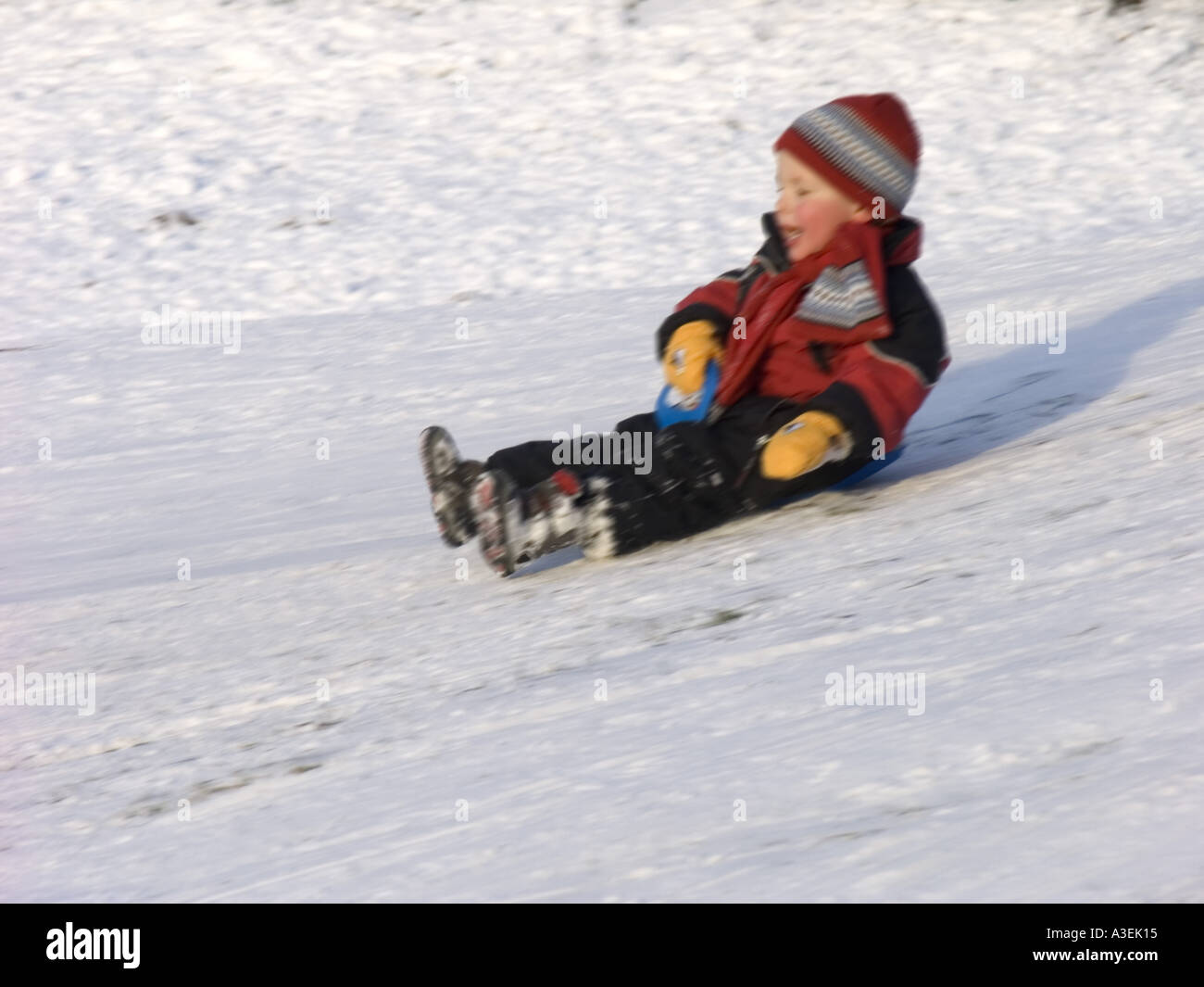 Boy Sliding On Ice