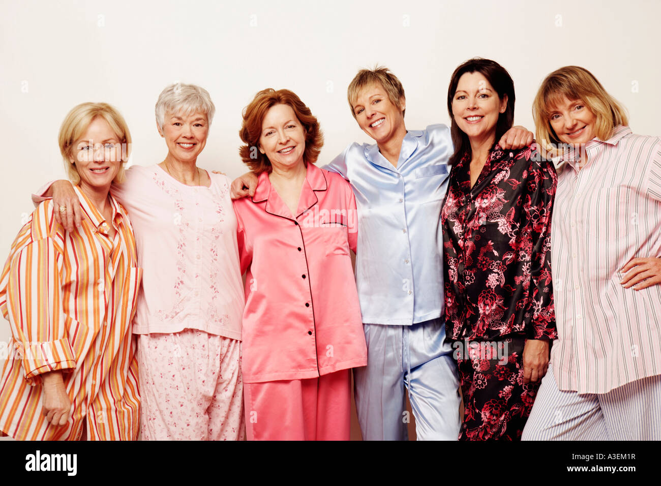 Portrait of a group of people standing together and smiling Stock Photo