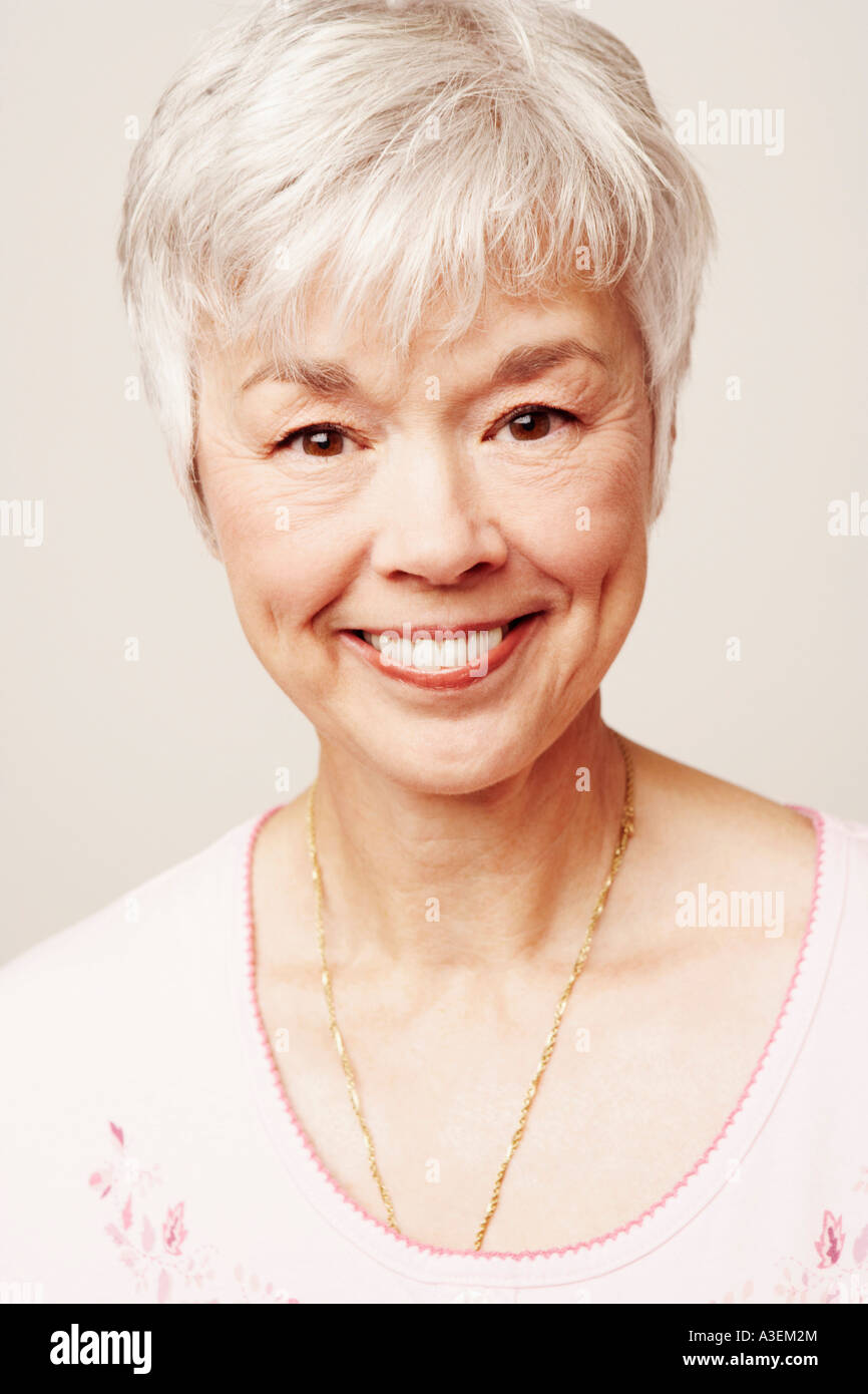 Portrait of a senior woman smiling Stock Photo - Alamy