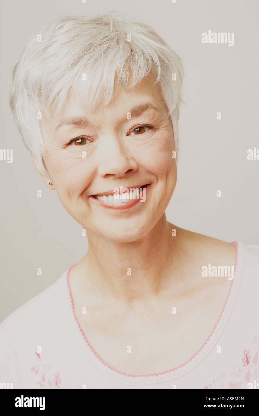 Portrait of a senior woman smiling Stock Photo - Alamy
