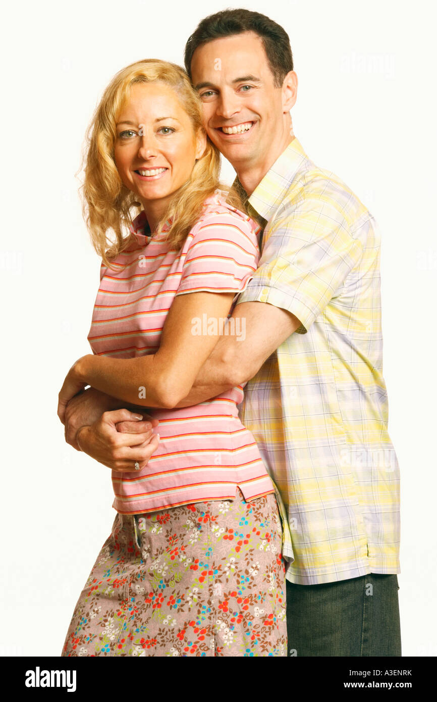 Portrait of a mature man embracing a mature woman from behind Stock ...