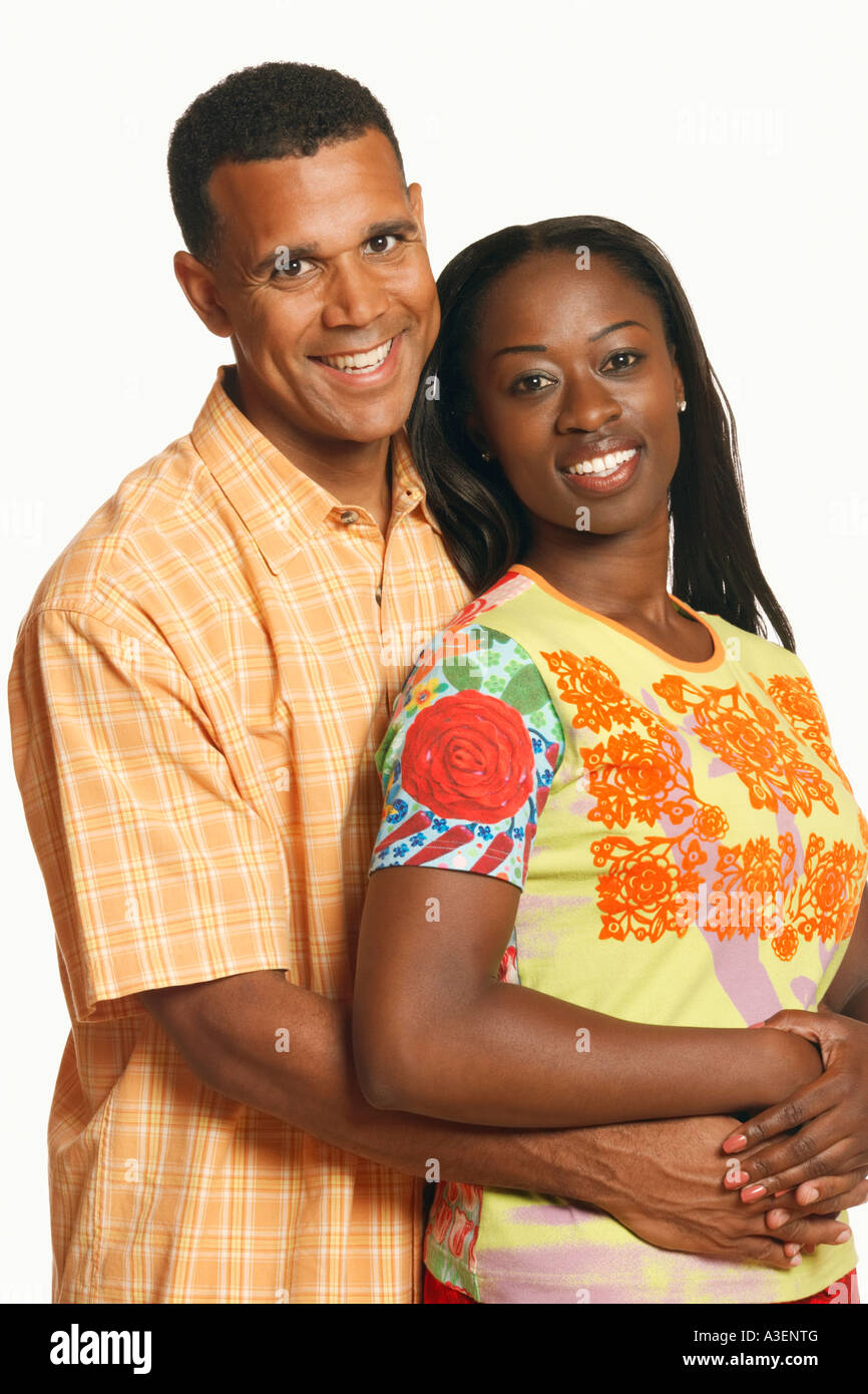 Portrait of a mature man embracing a mid adult woman from behind Stock ...