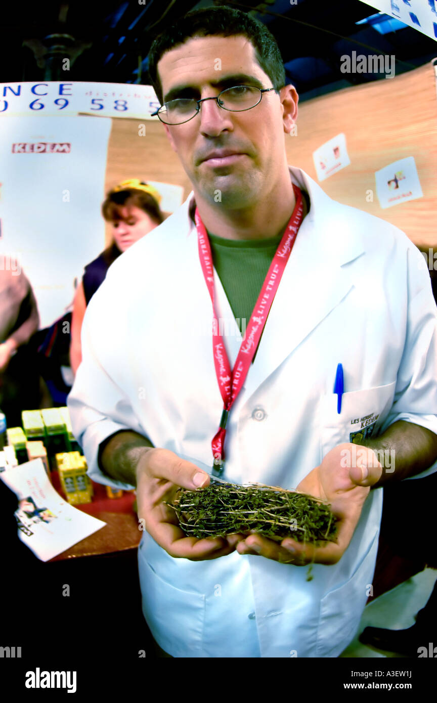 Paris France, Scientist Holding Sample in ORGANIC EXHIBIT OF A SMALL ISRAELI COMPANY Herbal Medecine 'THE HERBS OF KEDKA' Stock Photo