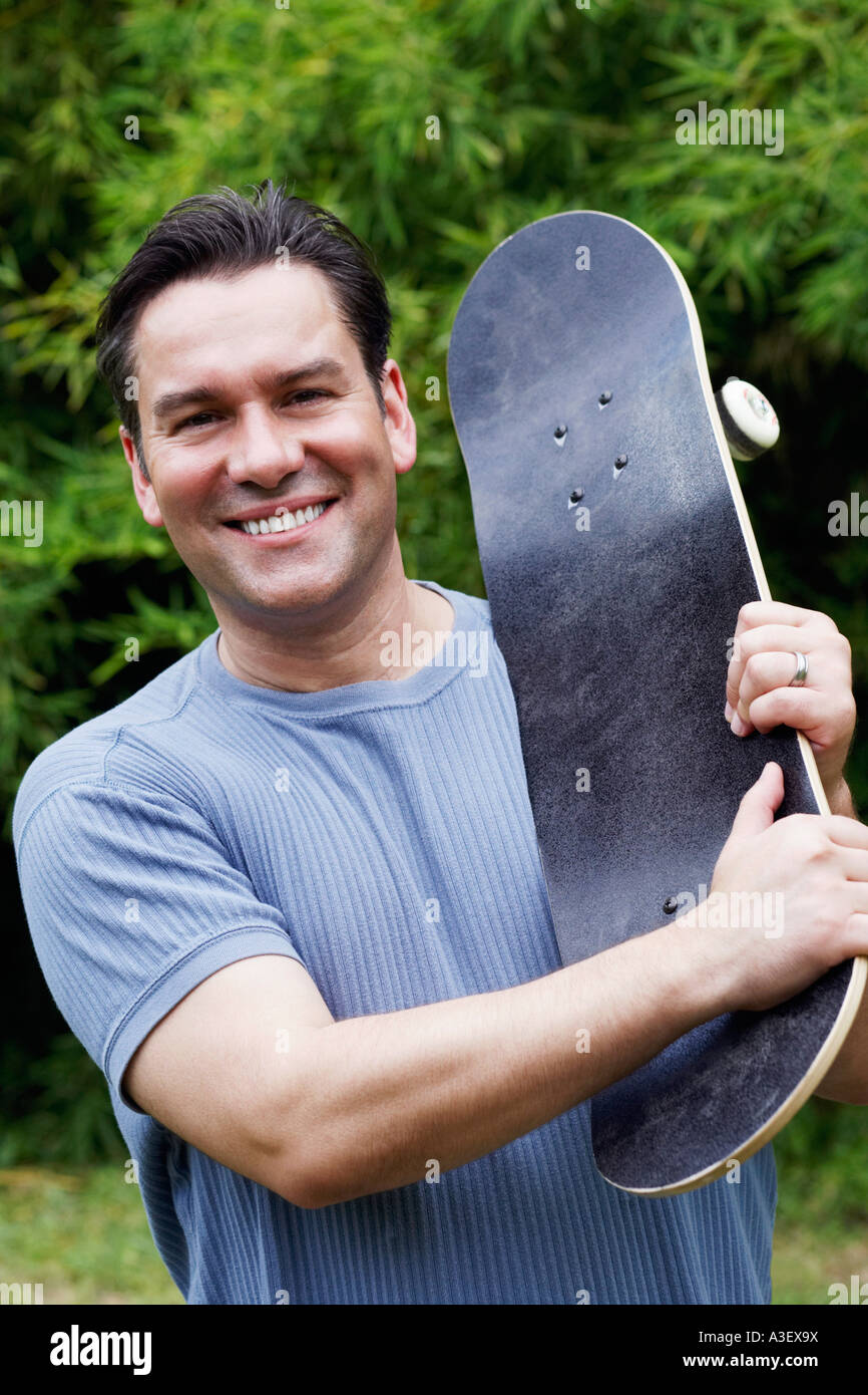 Holding a skateboard hires stock photography and images Alamy