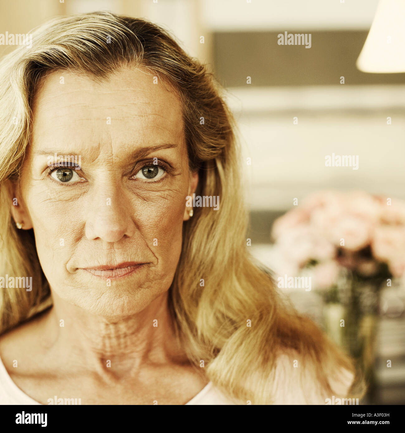 Portrait of a mature woman looking serious Stock Photo - Alamy