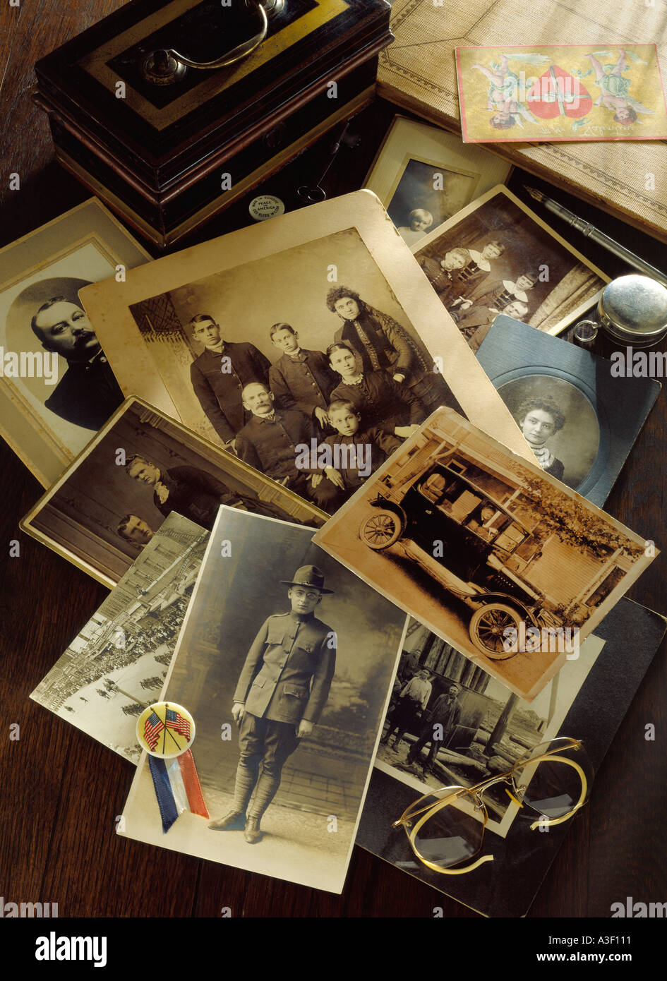 Photo editorial pictorial depiction of generic family history from 1800s through WW1 with antique photos related items Stock Photo
