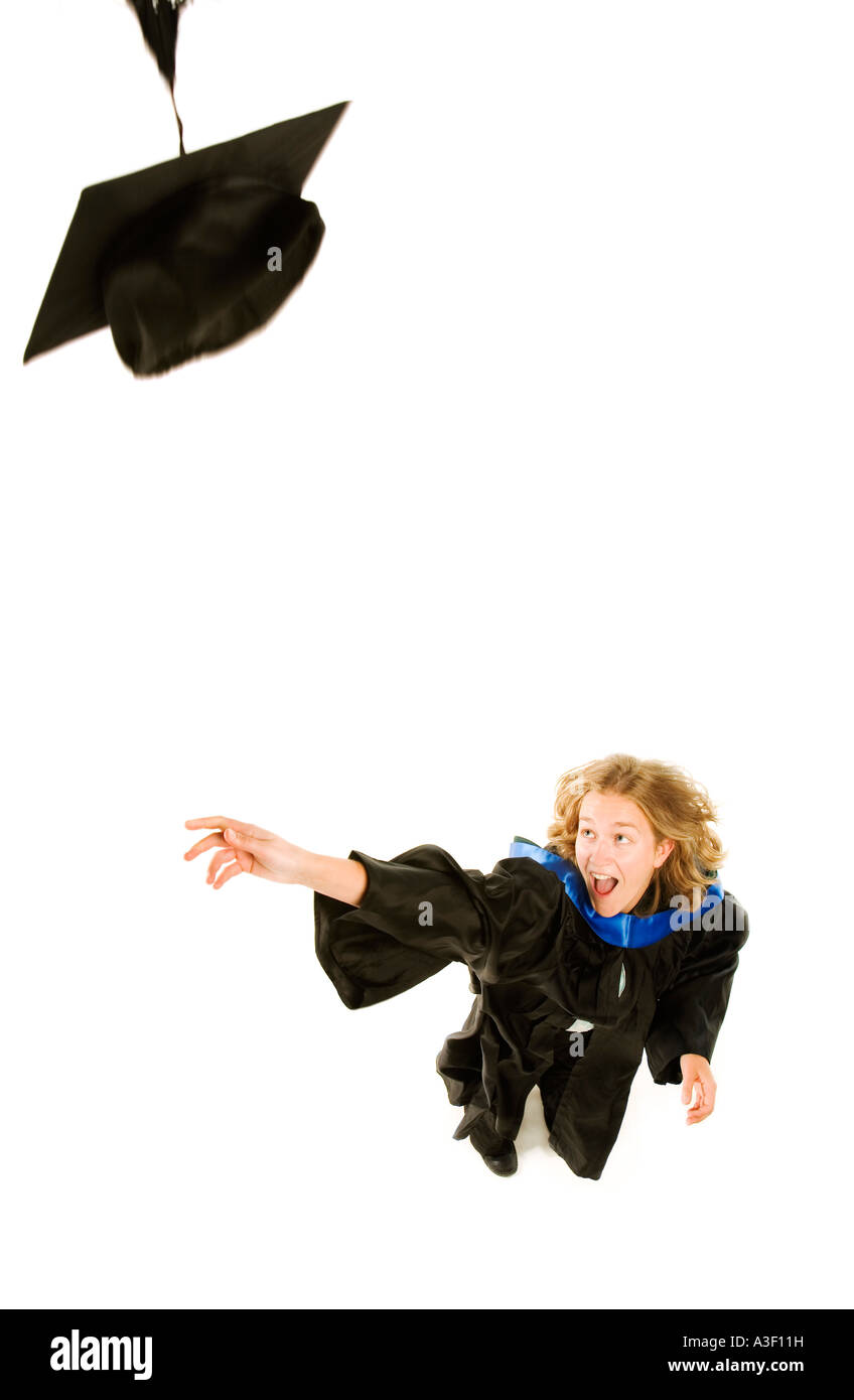 Graduate throwing her cap Stock Photo
