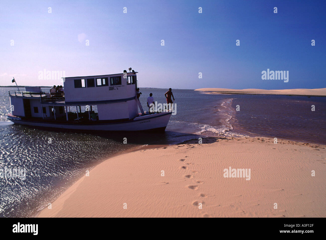Boat in the dunes at Paraiba river delta Northeast of Brazil Stock Photo